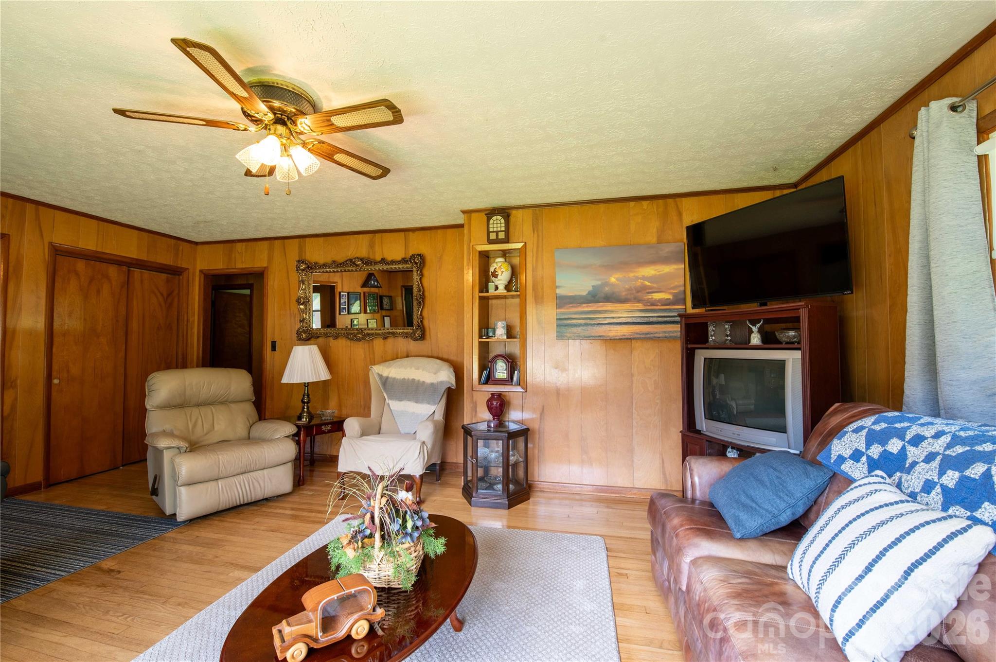40 Double Island Road Burnsville, NC 28714 - Photo 10 of 38 a living room with furniture and a flat screen tv