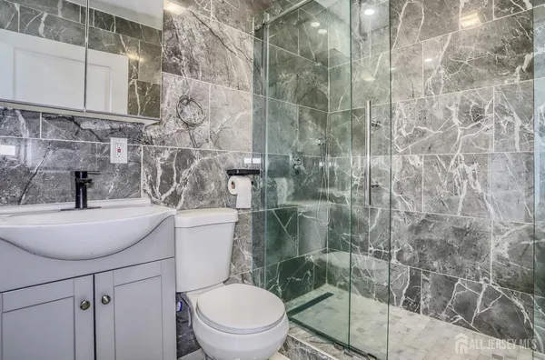 a bathroom with a toilet and a sink