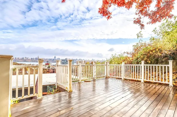 a view of a balcony with wooden floor