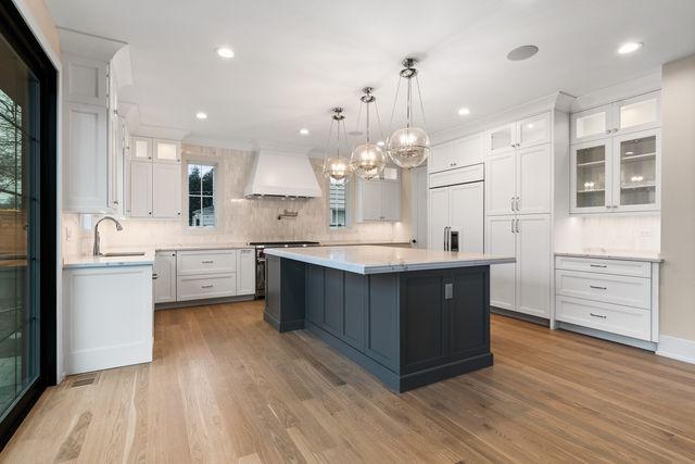 a kitchen with a stove and a sink