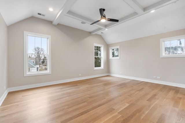 a spacious bathroom with a double vanity sink a mirror and a bathtub