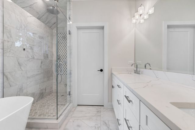 a bathroom with a sink double vanity and a mirror