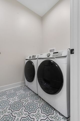 a view of empty room with wooden floor and fireplace