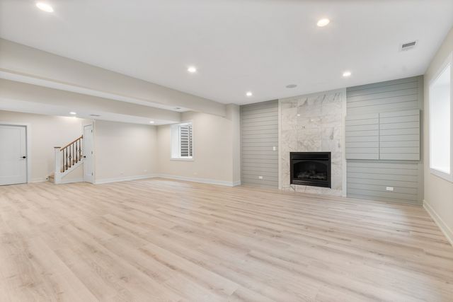 a view of an empty room with a kitchen