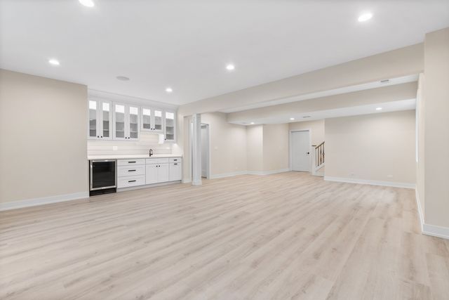 a bathroom with a granite countertop sink a toilet and shower