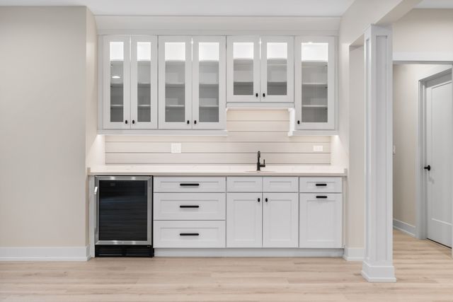a kitchen with kitchen island cabinets and wooden floor