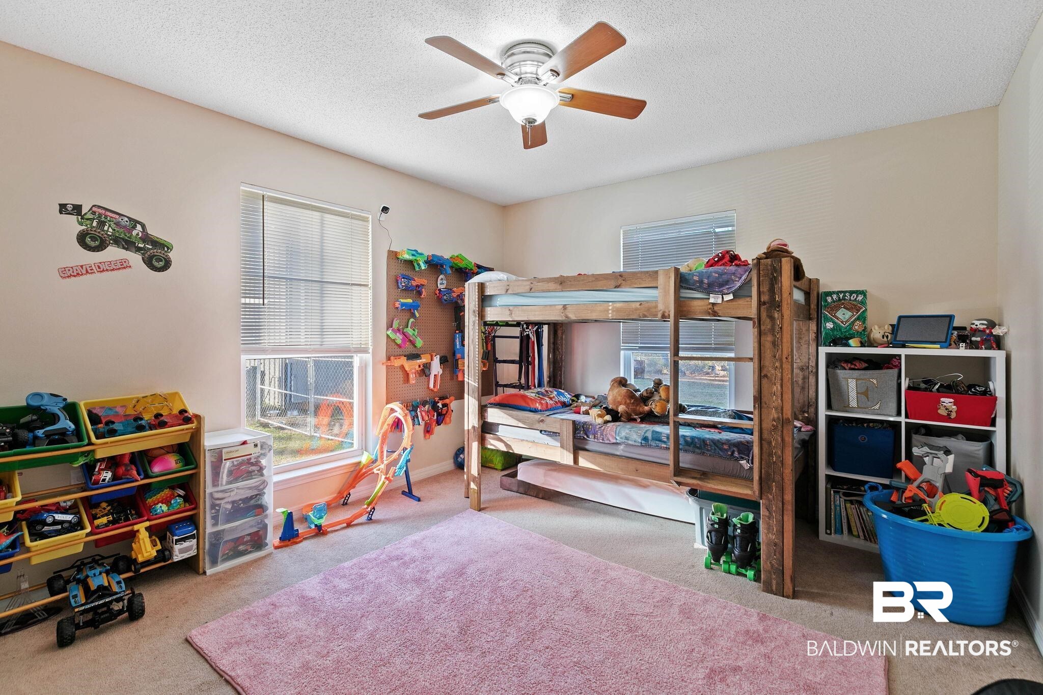 55750 Lottie Road Perdido, AL 36562 - Photo 47 of 84 Bedroom featuring light carpet, a ceiling fan, a textured ceiling, and multiple windows
