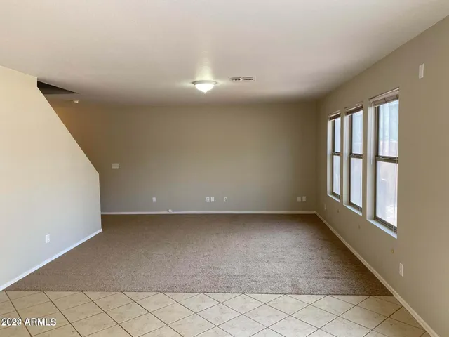 a view of a livingroom and a hallway