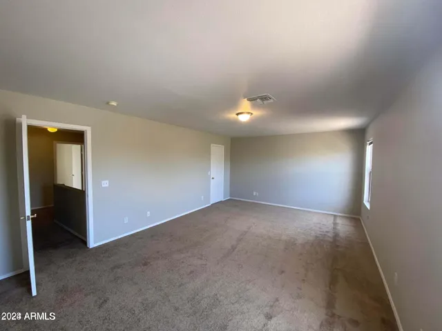 a view of hallway with wooden floor