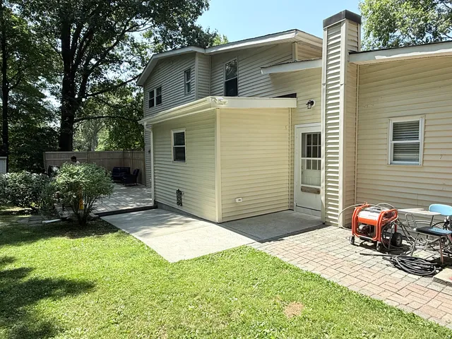 a view of a backyard with swimming pool