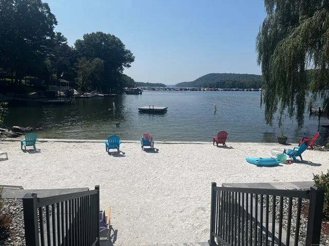 a view of a backyard with plants and outdoor seating