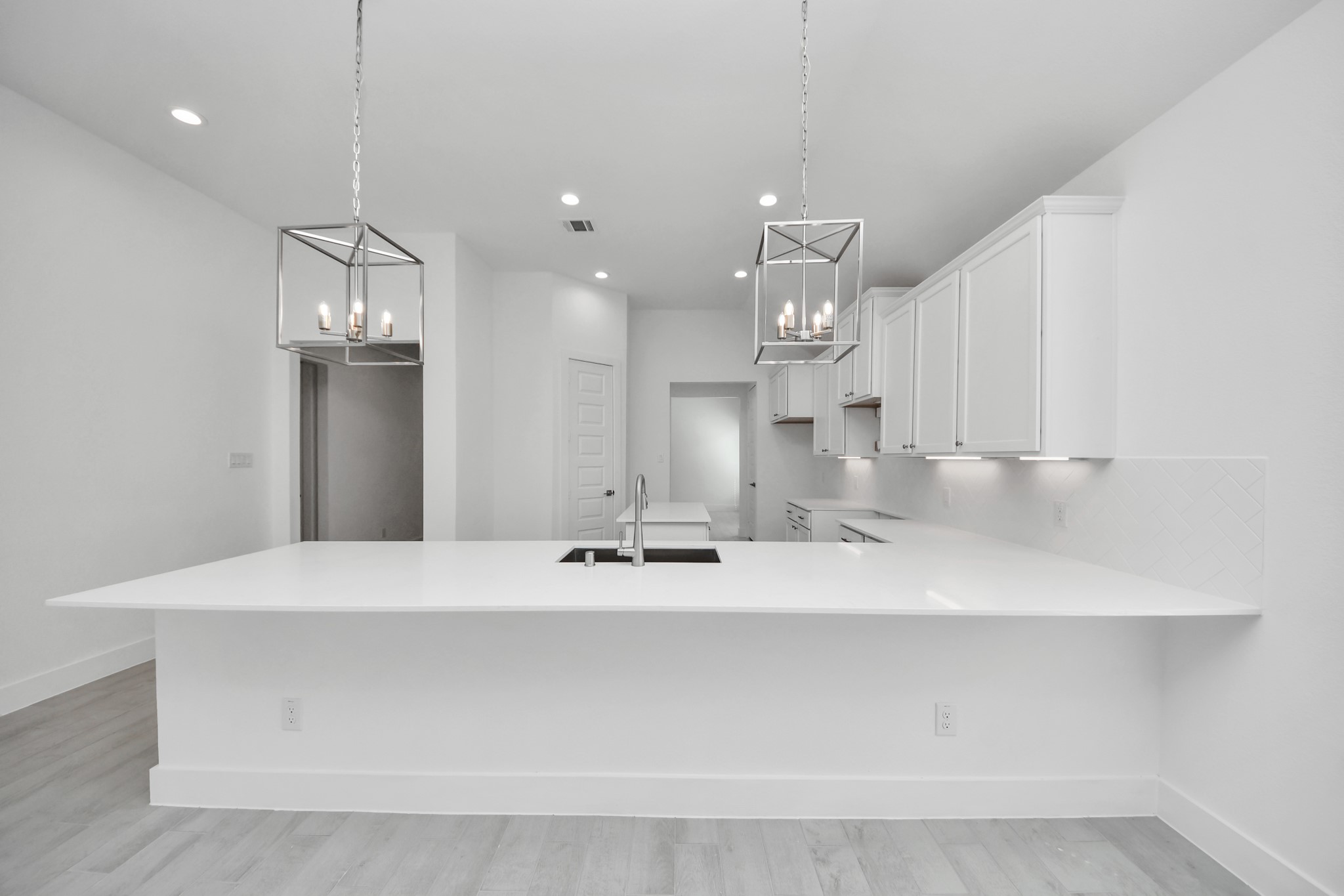 3042 Native Spg Drive Spring, TX 77373 - Photo 20 of 40 The extended counter area adds both practicality and style, making meal preparation a breeze. Every detail is thoughtfully designed to enhance the kitchen's functionality and aesthetic appeal.