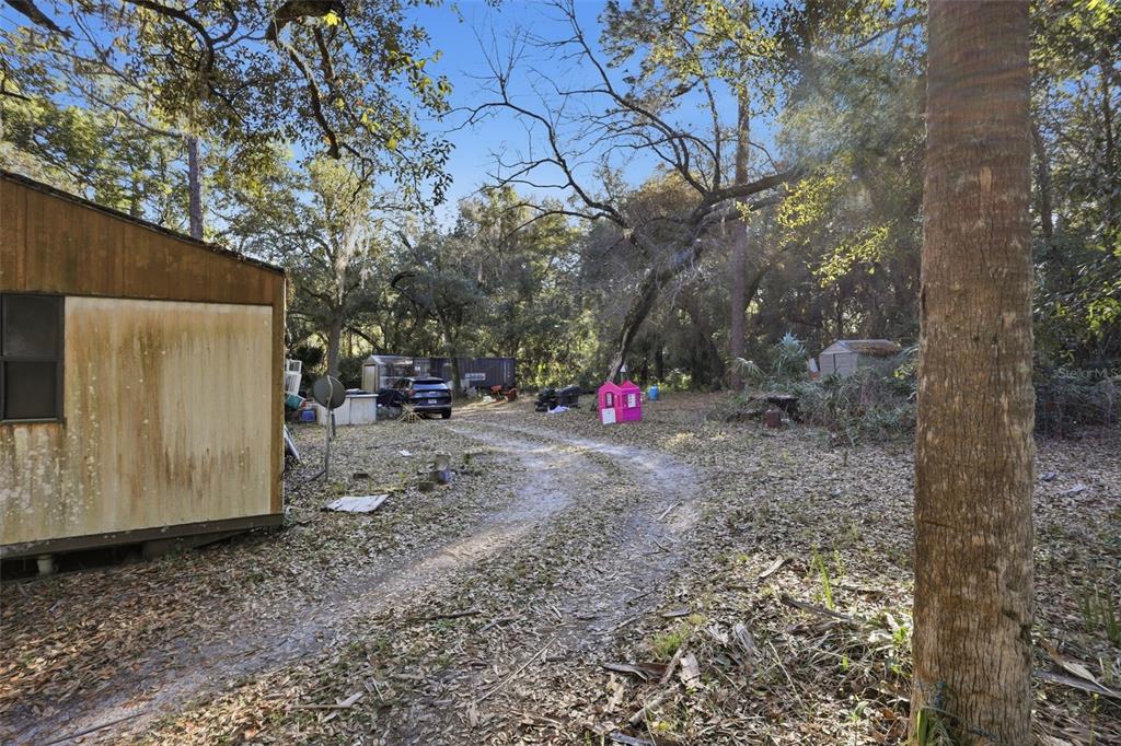 932 Country Club Road Lake Mary, FL 32746 - Photo 15 of 31 a view of a backyard with large tree