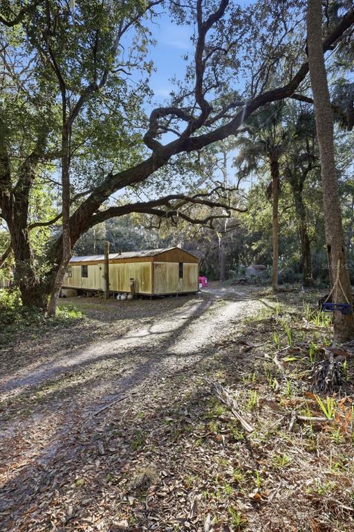 932 Country Club Road Lake Mary, FL 32746 - Photo 28 of 31 a front view of a house with a yard