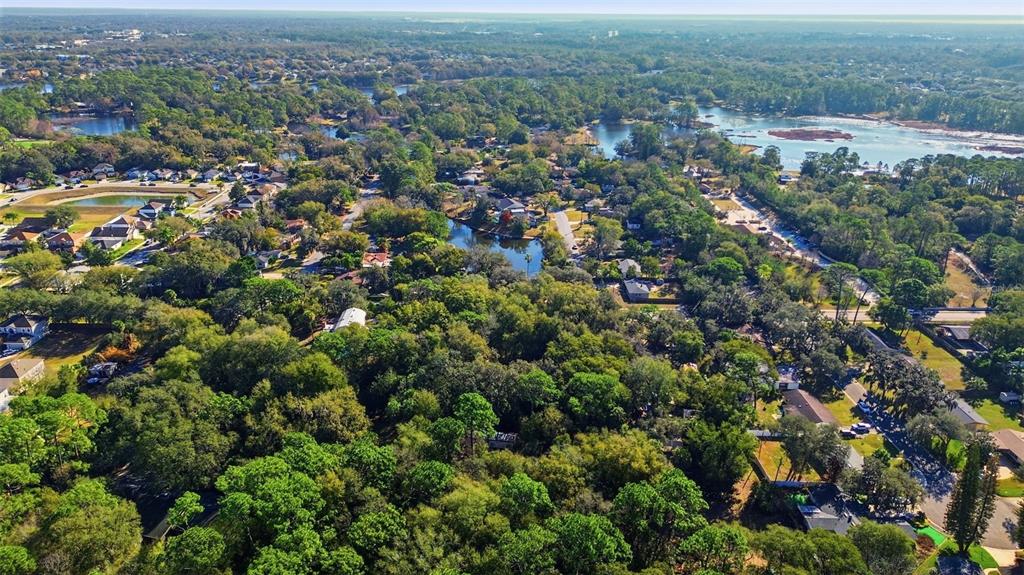 932 Country Club Road Lake Mary, FL 32746 - Photo 4 of 31 an aerial view of residential houses with outdoor space and trees