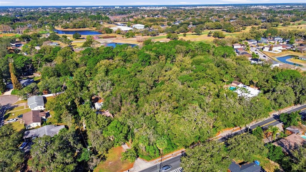 932 Country Club Road Lake Mary, FL 32746 - Photo 7 of 31 an aerial view of residential houses with outdoor space and trees
