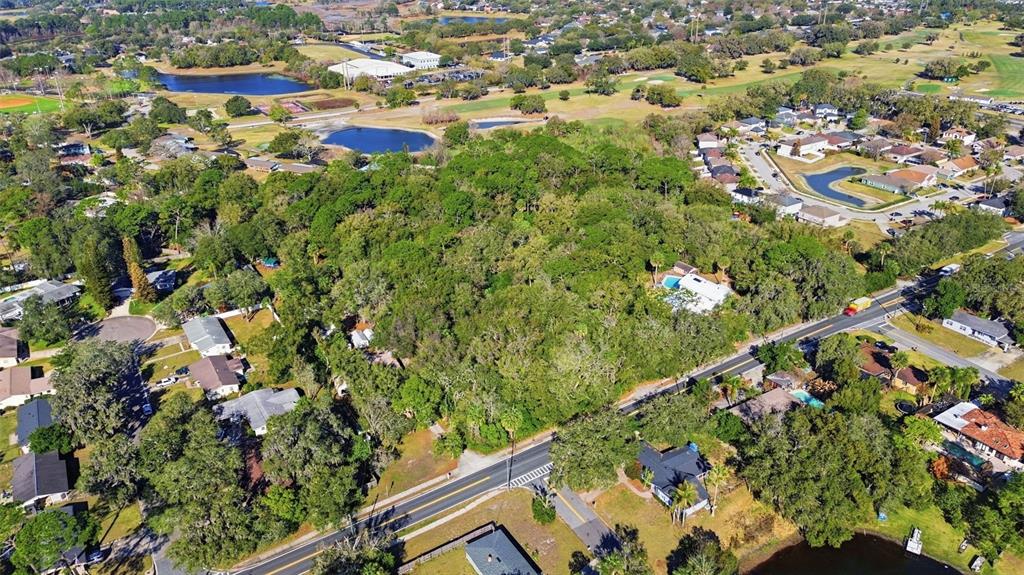 932 Country Club Road Lake Mary, FL 32746 - Photo 8 of 31 an aerial view of residential houses with outdoor space