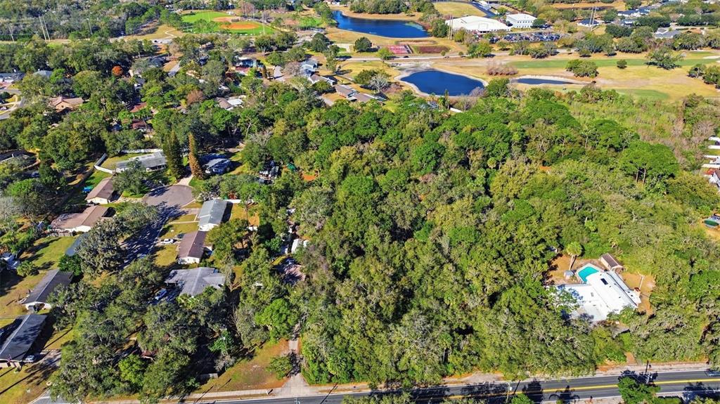 932 Country Club Road Lake Mary, FL 32746 - Photo 9 of 31 an aerial view of residential house with yard and outdoor seating