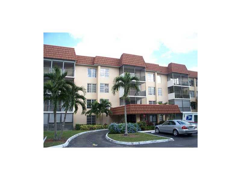 4166 Inverrary Drive, Unit 307 Lauderhill, FL 33319 - Photo 1 of 17 a view of a building and a yard