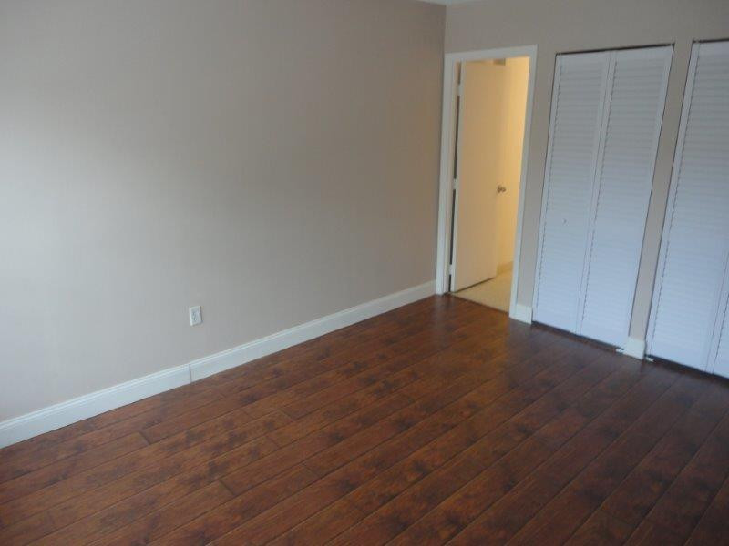 4166 Inverrary Drive, Unit 307 Lauderhill, FL 33319 - Photo 14 of 17 a view of an empty room with wooden floor