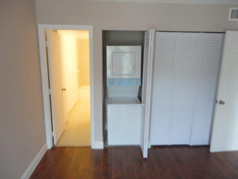 4166 Inverrary Drive, Unit 307 Lauderhill, FL 33319 - Photo 15 of 17 an empty room with wooden floor and closet