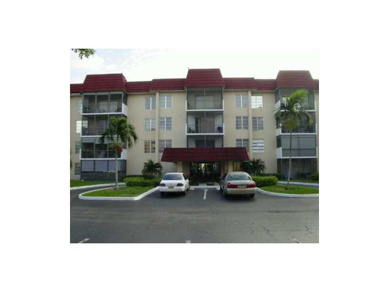 4166 Inverrary Drive, Unit 307 Lauderhill, FL 33319 - Photo 2 of 17 a houses covered with tall trees