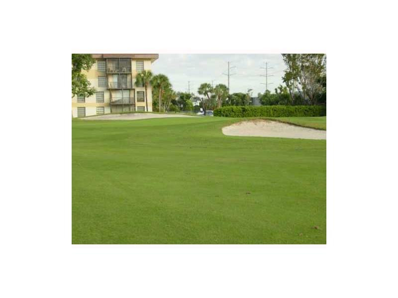4166 Inverrary Drive, Unit 307 Lauderhill, FL 33319 - Photo 3 of 17 a view of a big yard with an outdoor space