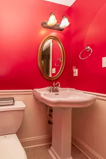 a bathroom with a toilet and a sink