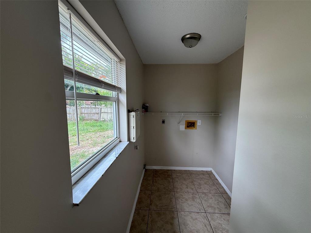 855 Jamaica Road Venice, FL 34293 - Photo 13 of 19 a view of an empty room and window