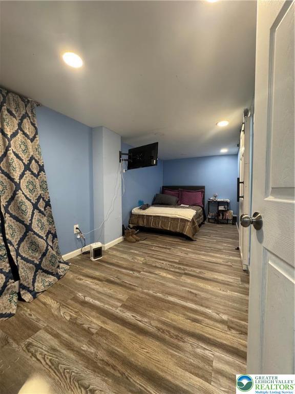 414 Washington Street Allentown, PA 18102 - Photo 18 of 23 a bedroom with a bed and a chair