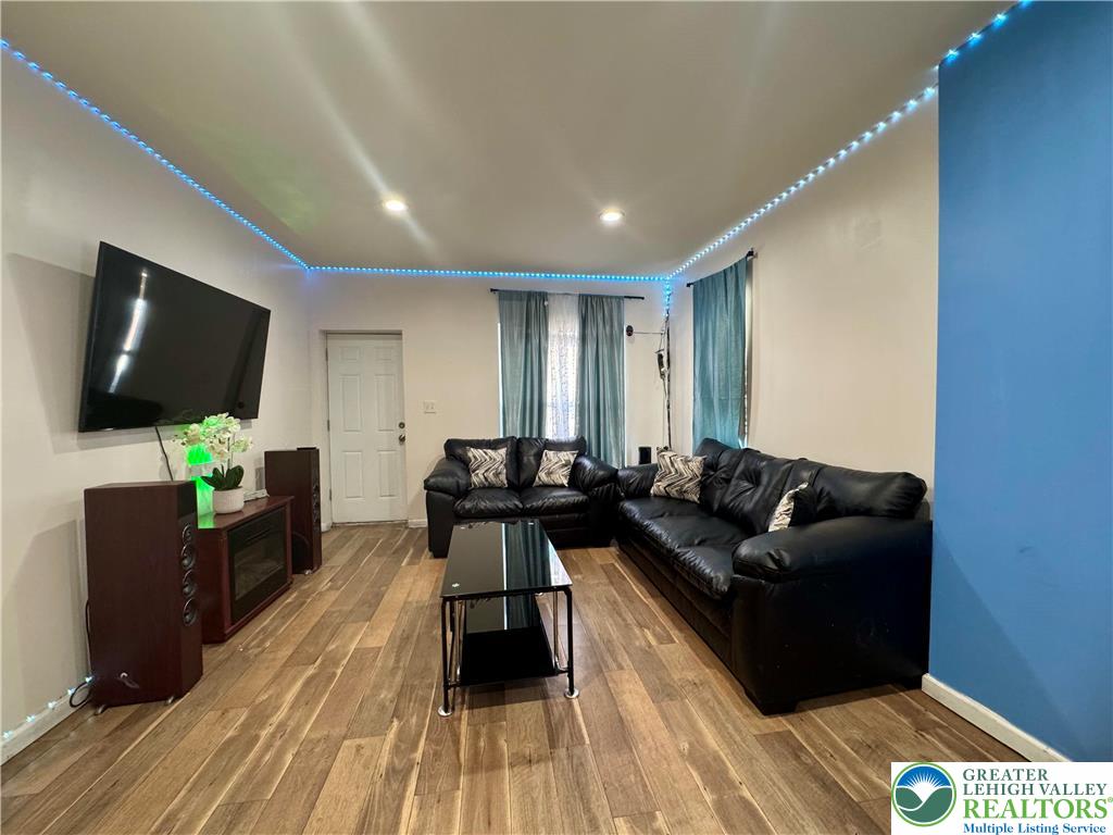 414 Washington Street Allentown, PA 18102 - Photo 4 of 23 a living room with furniture and a flat screen tv