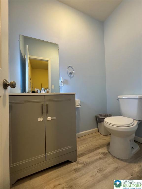 414 Washington Street Allentown, PA 18102 - Photo 8 of 23 a bathroom with a toilet a sink and mirror