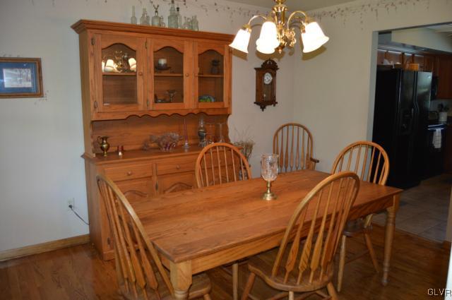 6168 Mud Run Road Nazareth, PA 18064 - Photo 17 of 35 a dining room with furniture and chandelier