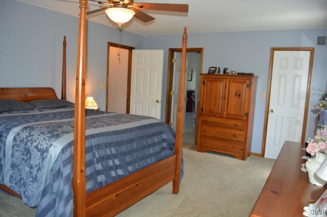 6168 Mud Run Road Nazareth, PA 18064 - Photo 20 of 35 a bedroom with a bed and a mirror