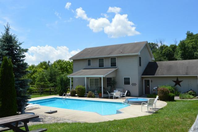 6168 Mud Run Road Nazareth, PA 18064 - Photo 31 of 35 a view of a house with swimming pool and sitting area