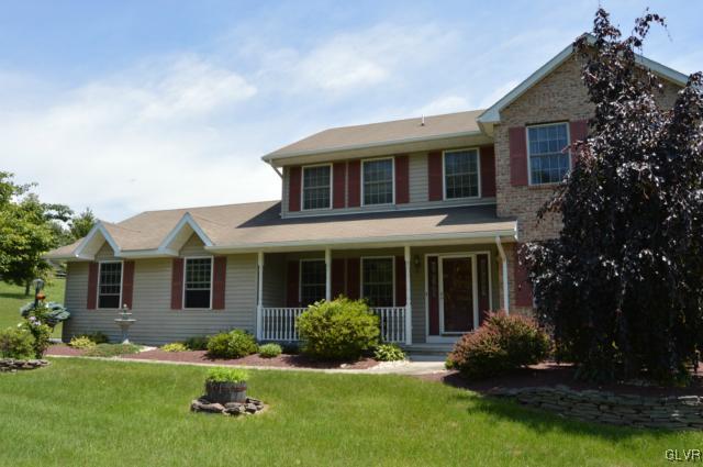 6168 Mud Run Road Nazareth, PA 18064 - Photo 4 of 35 a front view of a house with garden and porch