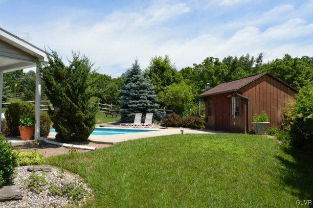 6168 Mud Run Road Nazareth, PA 18064 - Photo 6 of 35 a view of a house with backyard and a tree