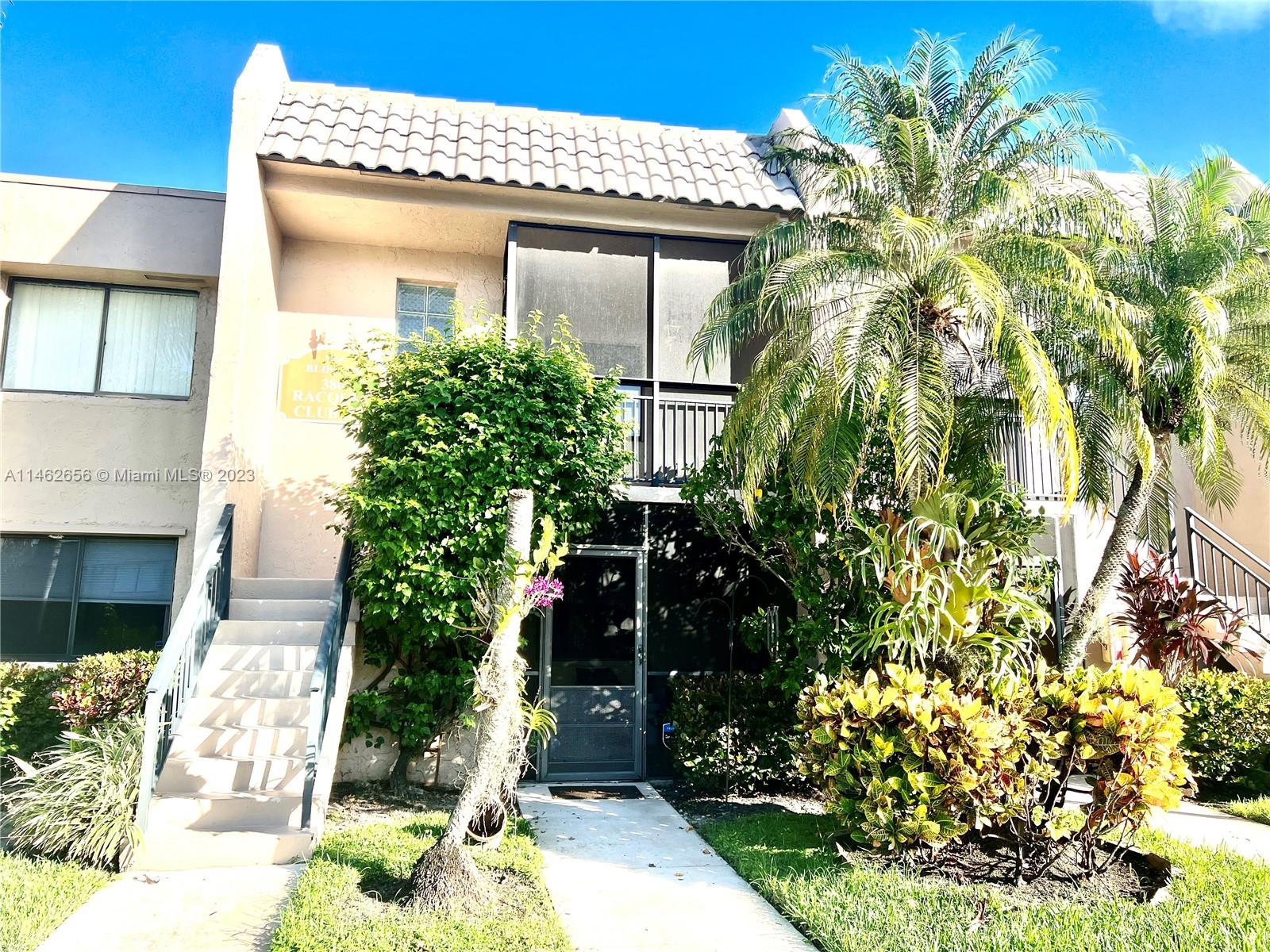 380 Racquet Club Road, Unit 202 Weston, FL 33326 - Photo 1 of 34 a front view of a house with a yard