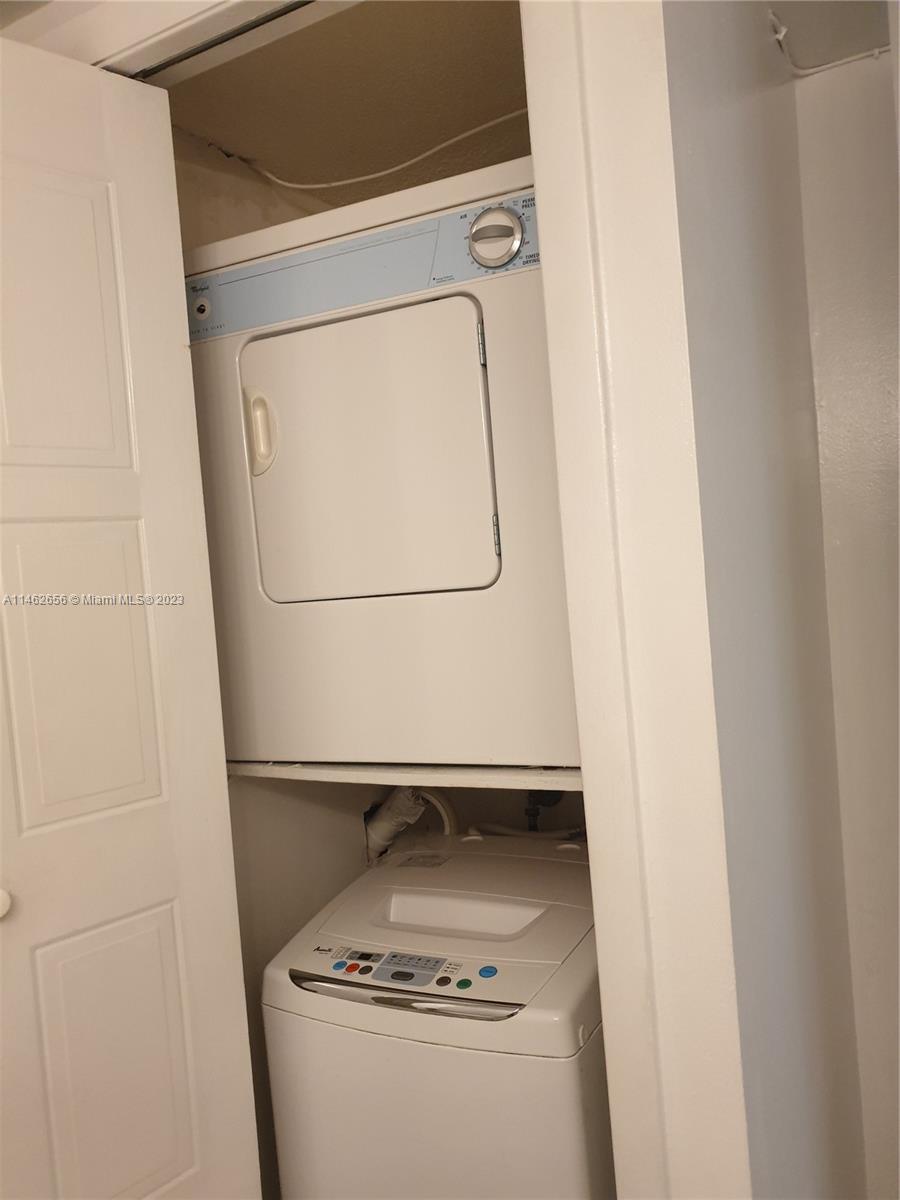 380 Racquet Club Road, Unit 202 Weston, FL 33326 - Photo 18 of 34 a room with water heater and washer