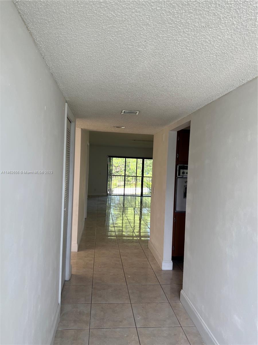 380 Racquet Club Road, Unit 202 Weston, FL 33326 - Photo 32 of 34 a view of an empty room with a window