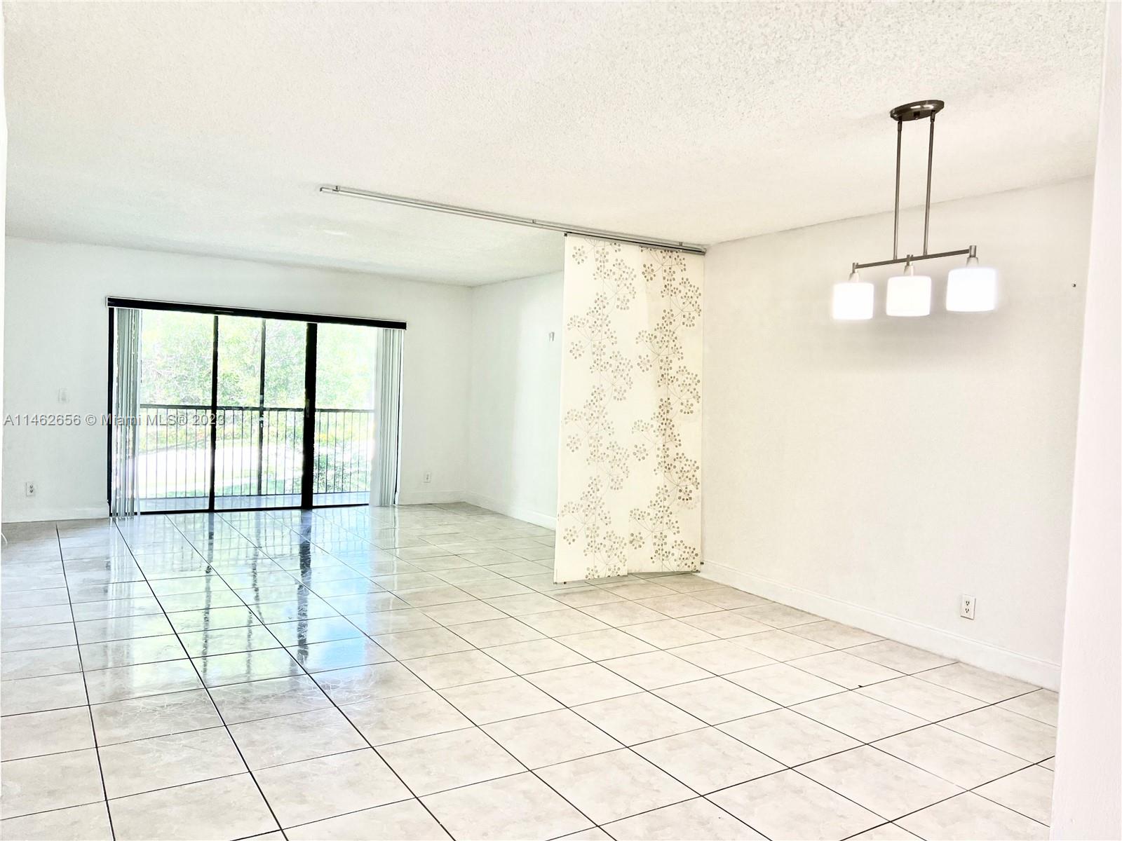 380 Racquet Club Road, Unit 202 Weston, FL 33326 - Photo 34 of 34 a view of an empty room and window