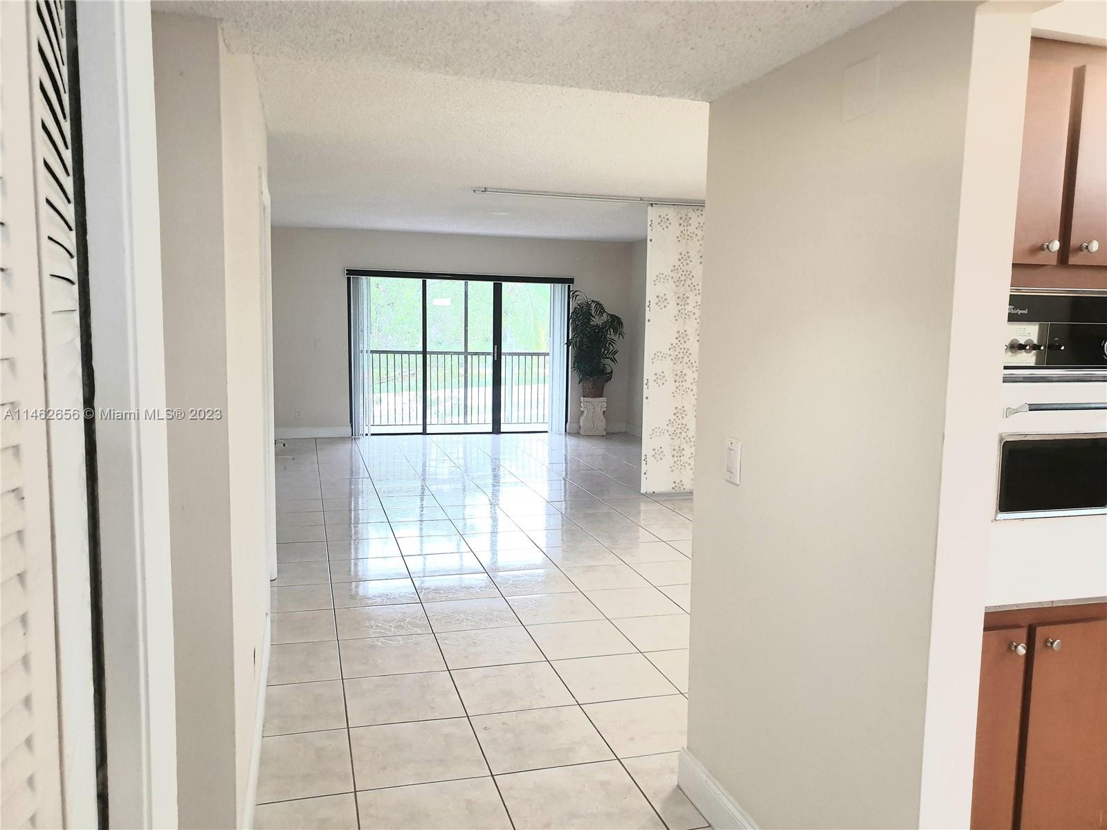 380 Racquet Club Road, Unit 202 Weston, FL 33326 - Photo 9 of 34 a view of kitchen with windows
