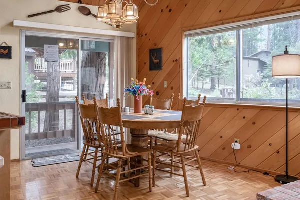 a dining room with furniture and window
