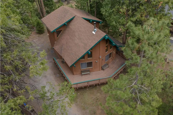 an aerial view of a house with outdoor space