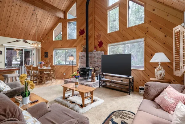 a outdoor living space with patio furniture and a fireplace