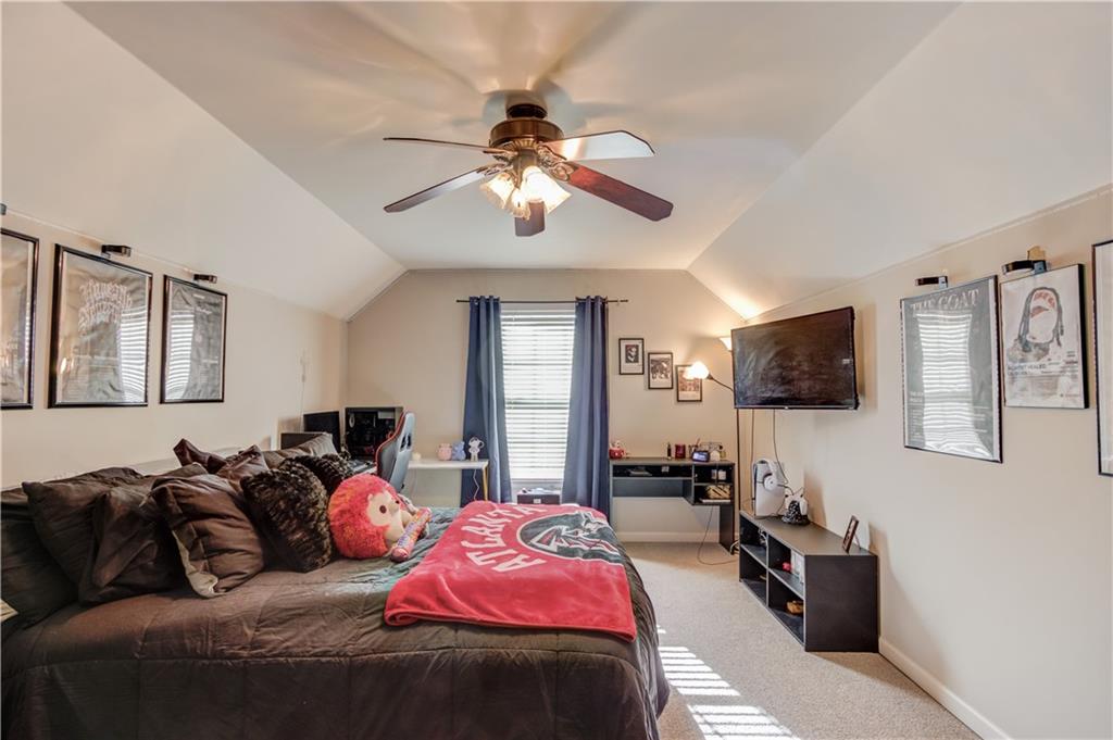2630 Snowcrest Place Bethlehem, GA 30620 - Photo 23 of 39 a bedroom with a bed and a flat screen tv
