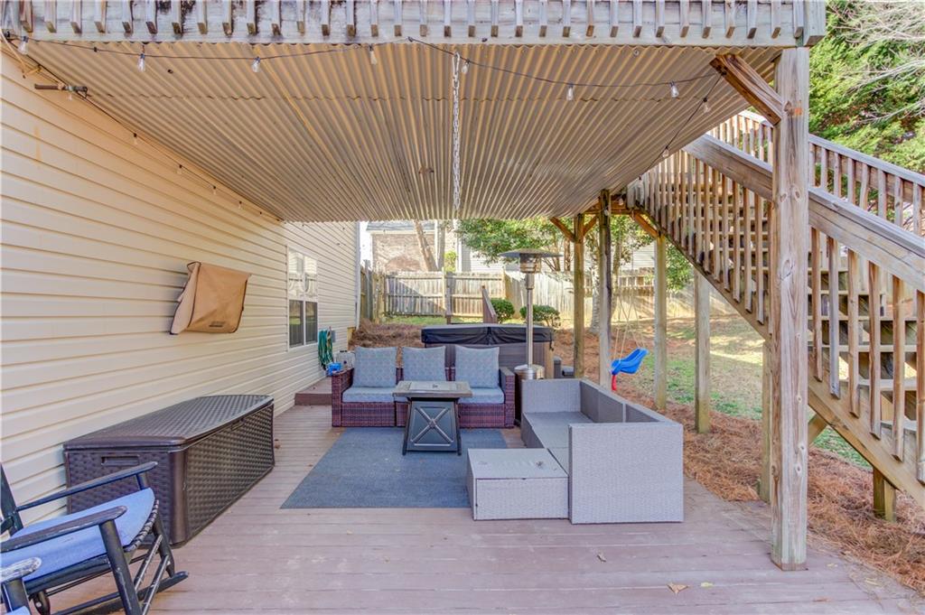 2630 Snowcrest Place Bethlehem, GA 30620 - Photo 29 of 39 a outdoor space with patio the couches and a potted plant on a wooden floor