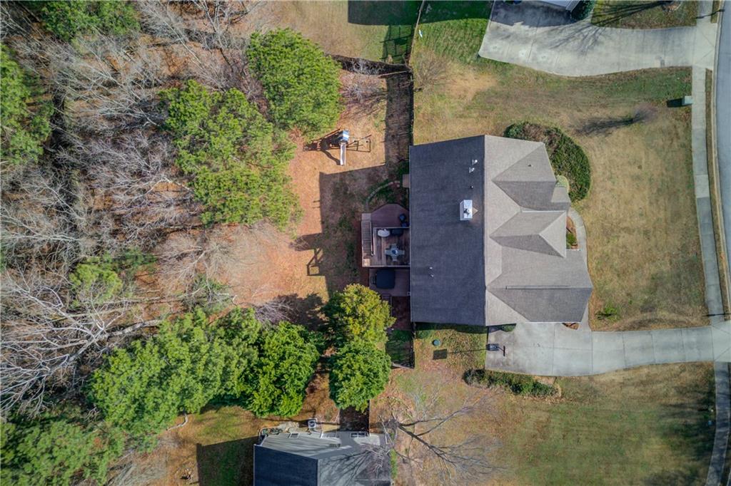 2630 Snowcrest Place Bethlehem, GA 30620 - Photo 34 of 39 an aerial view of a house with a yard and large tree