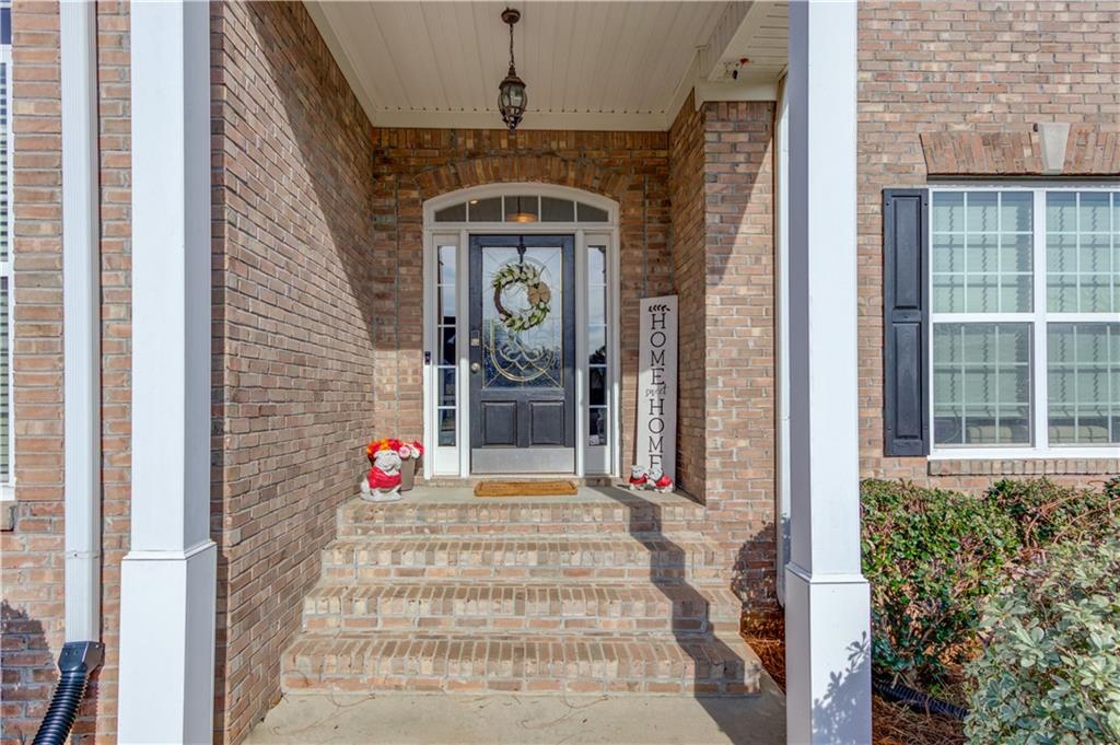 2630 Snowcrest Place Bethlehem, GA 30620 - Photo 4 of 39 a front view of a house with potted plants