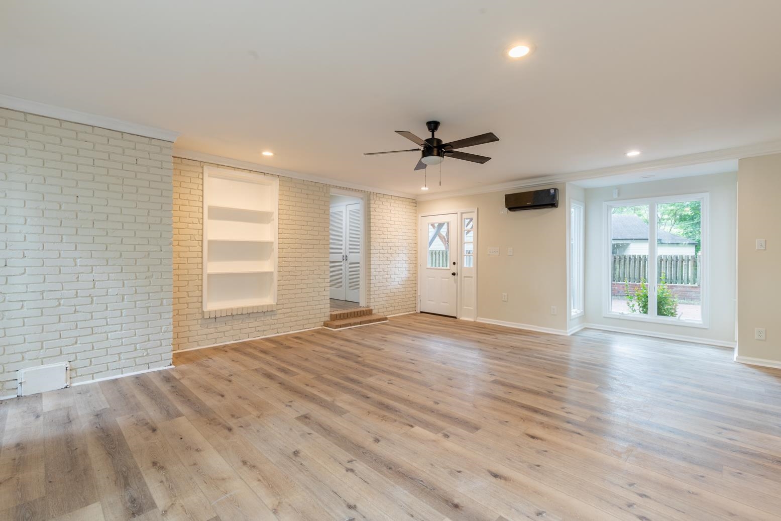505 Thorn Ridge Cove Memphis, TN 38117 - Photo 18 of 31 a view of an empty room with a window and wooden floor